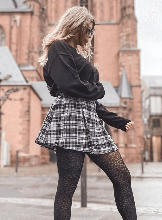 Irene Puig OnlyFans star wearing a short plaid skirt in the streets of Barcelona