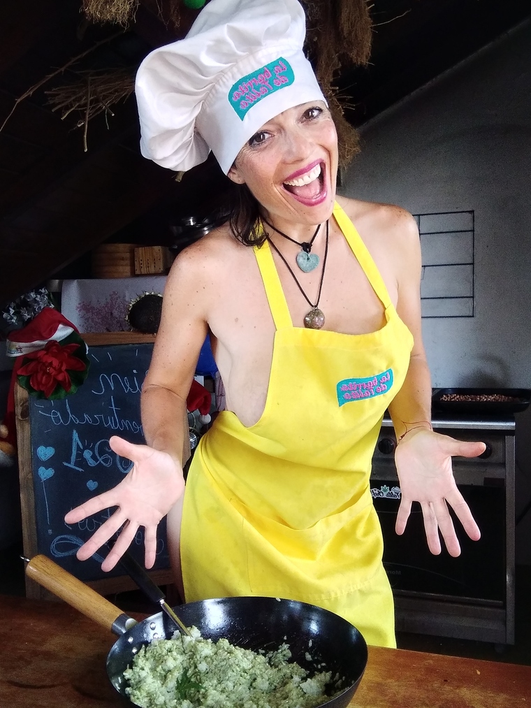 a woman in an apron in the kitchen