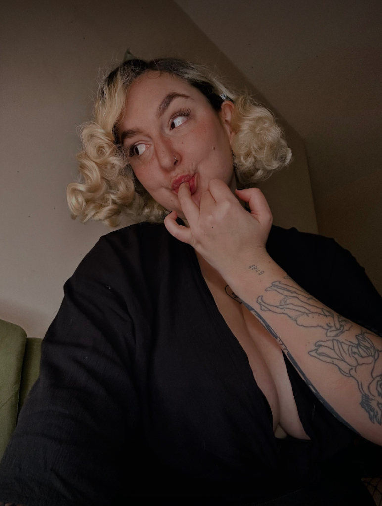 Jasmine @jas.monroe OnlyFans sexy model sucking her finger while showing  her arms with tattoo.
