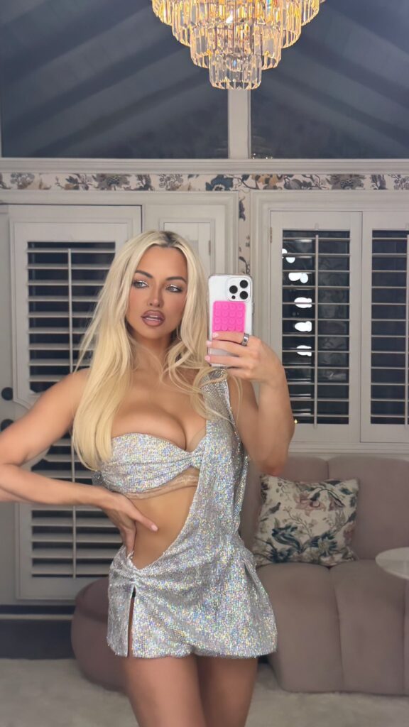 Lindsey Pelas OnlyFans shows off her beautiful body while taking a mirror selfie in a white short gown 