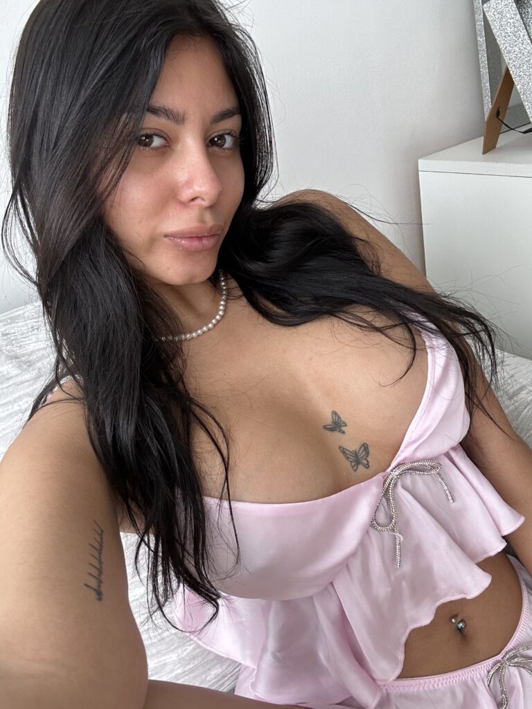 Grace Charis OnlyFans model wearing pink top and skirt