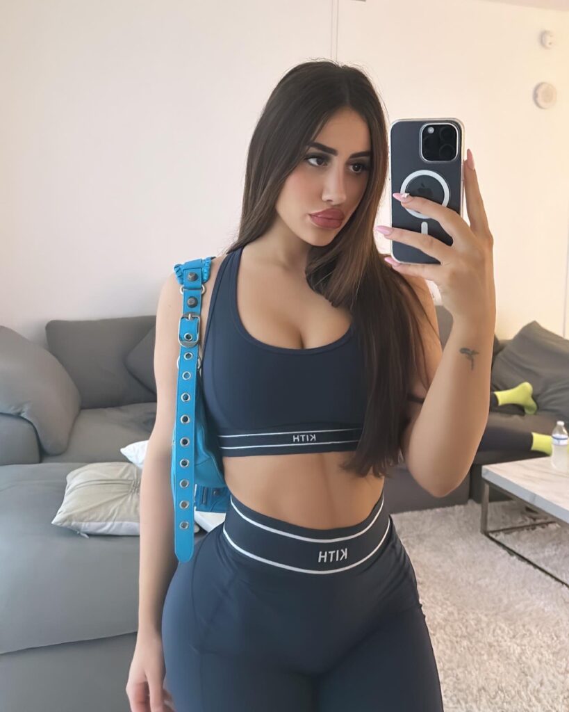 Ester Bron @esterbron OnlyFans model wearing black bra and leggings