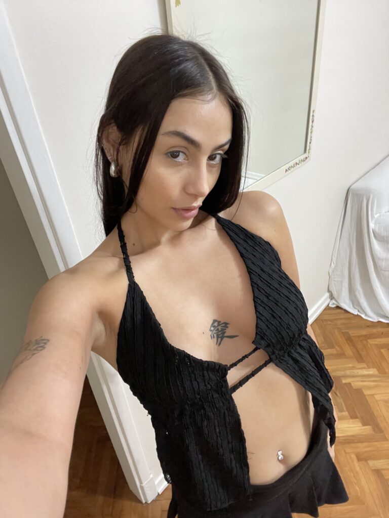 Lily Rose OnlyFans model wearing black top and mini skirt
