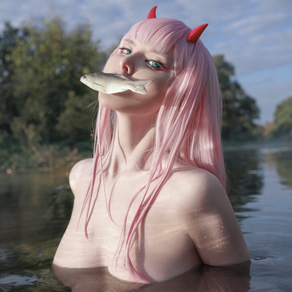 Vinne @Vinnegal OnlyFans cosplayer model wearing zero two costume biting on a fish