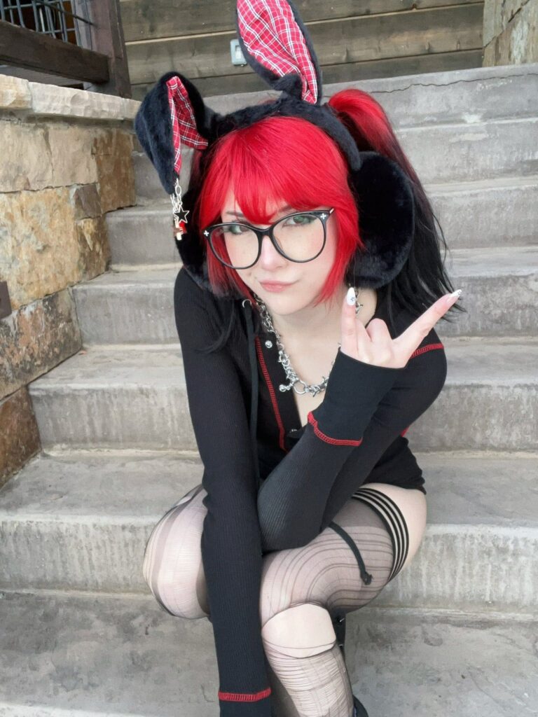 Meggiicosplay @notmeggii OnlyFans cosplayer model wearing black long sleeves sitting on the stair case