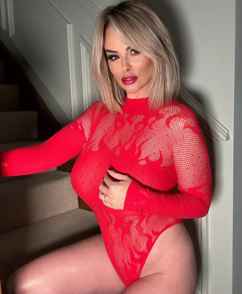 Rhian Sugden @rhiansugden OnlyFans big tits blonde model wearing red one piece
