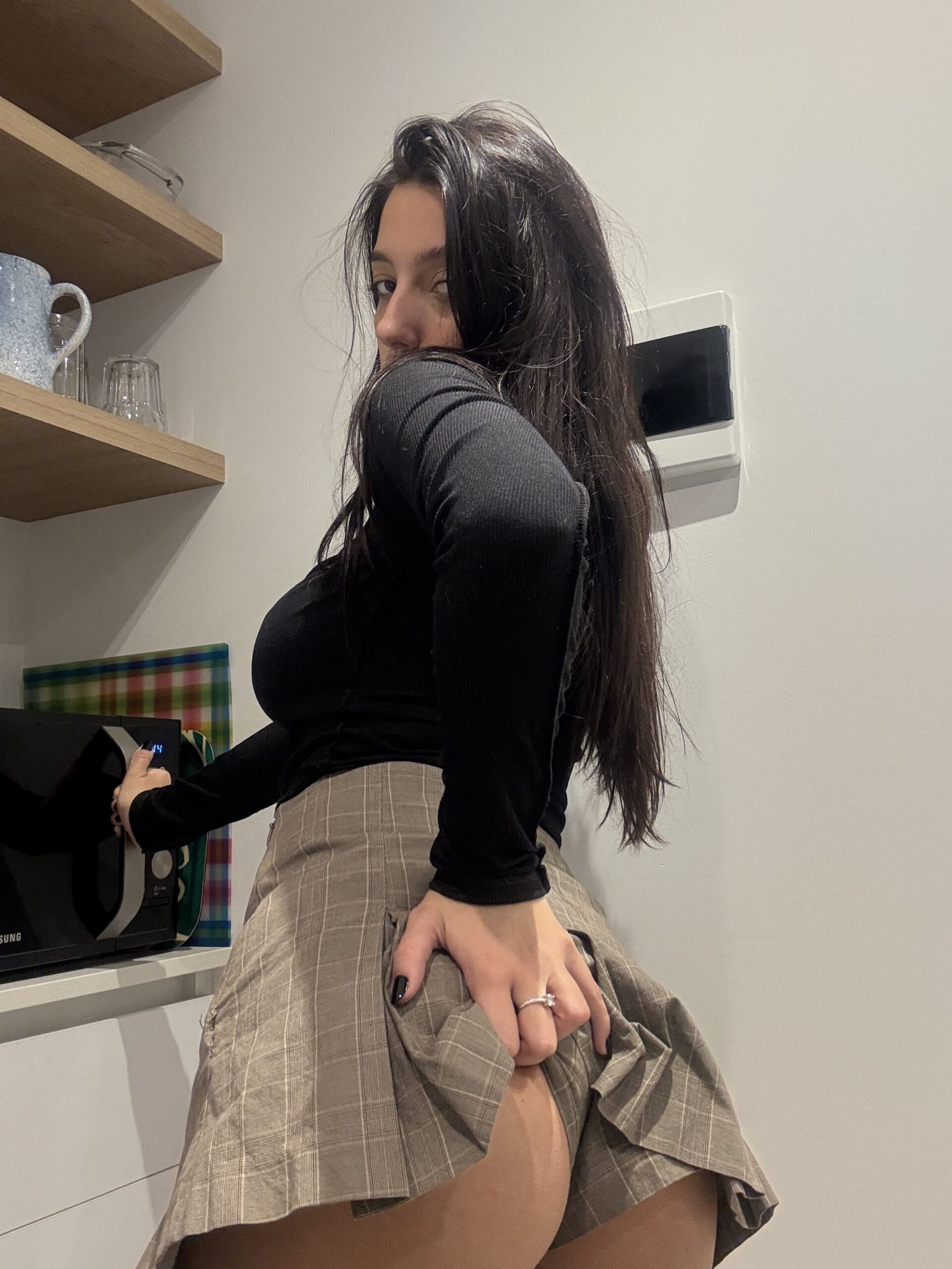 Lena Love @its.lenalove OnlyFans model wearing black long sleeves and mini skirt