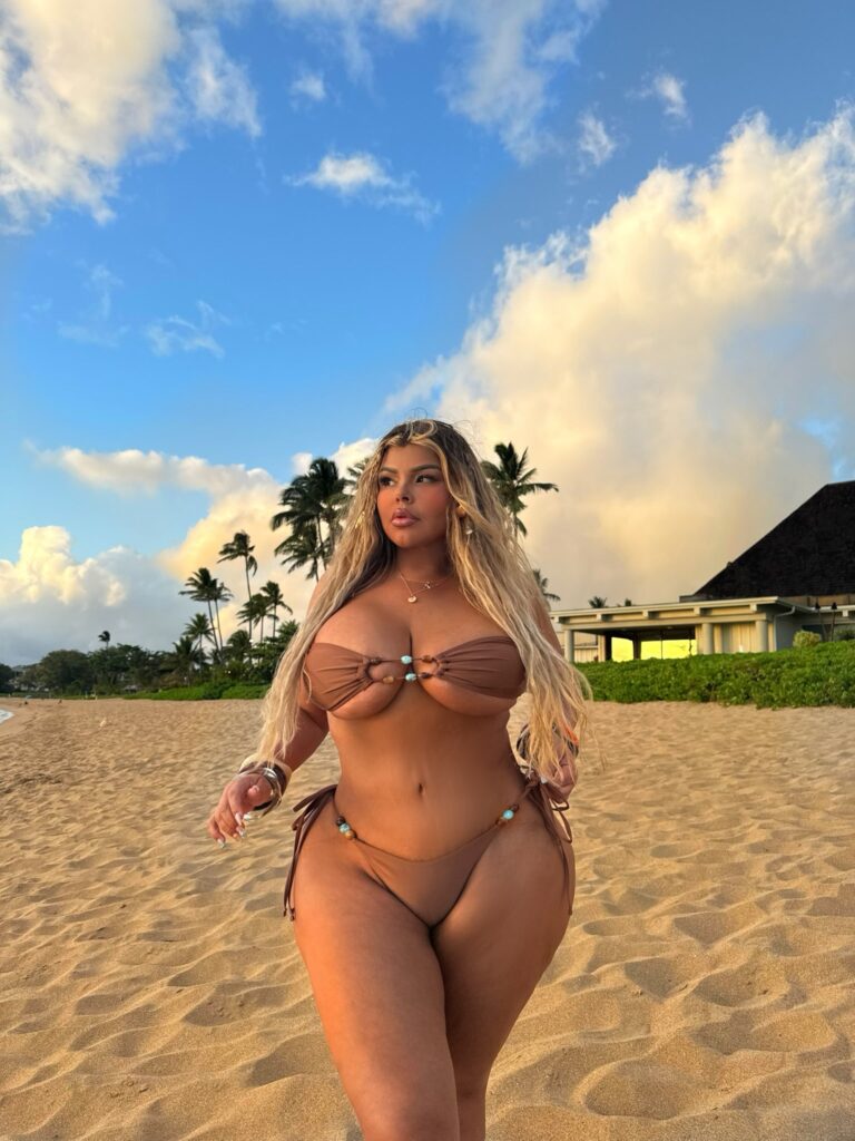 Shell Raven OnlyFans chubby model wearing brown two piece bikini at the beach