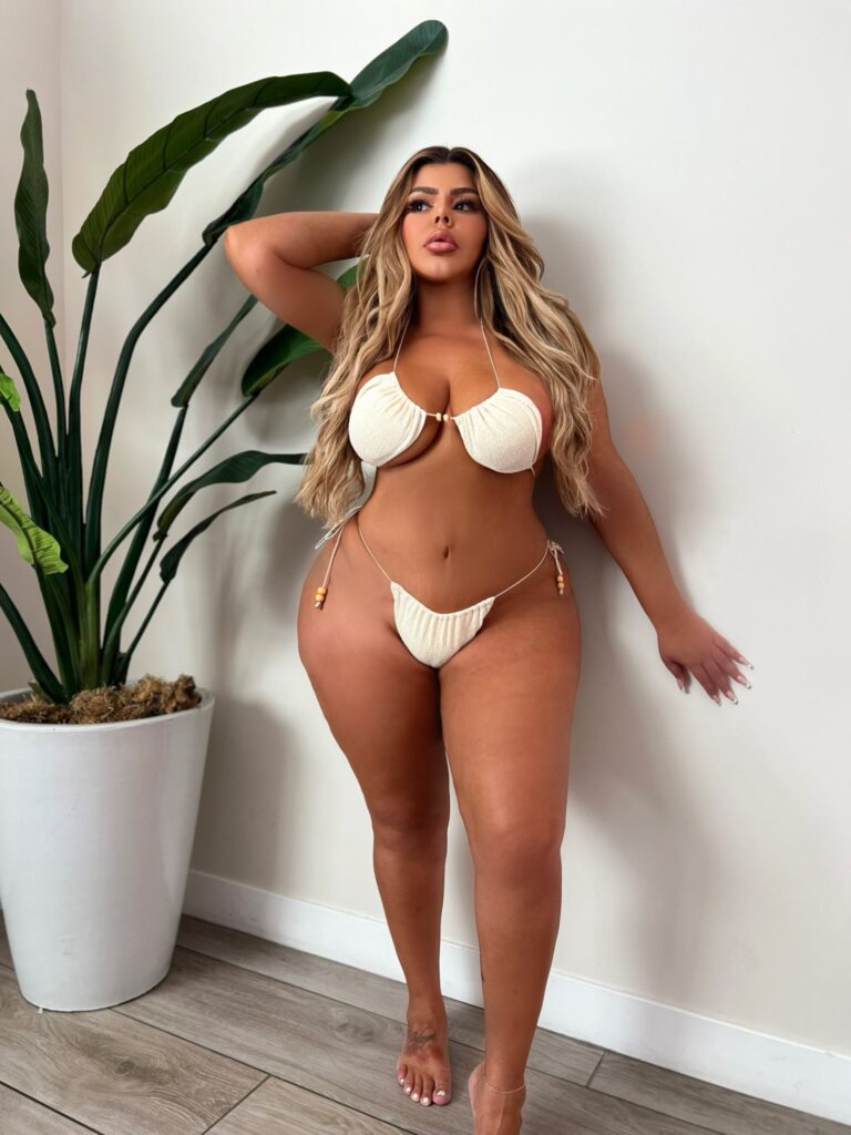 Shell Raven OnlyFans chubby model wearing white two piece bikini