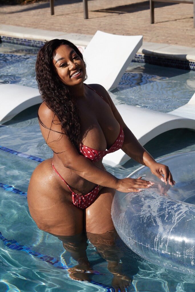 Brittney Tonee OnlyFans busty model wearing red two piece bikini