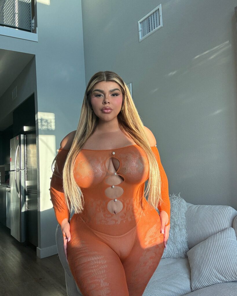 Shell Raven OnlyFans chubby model wearing orange net